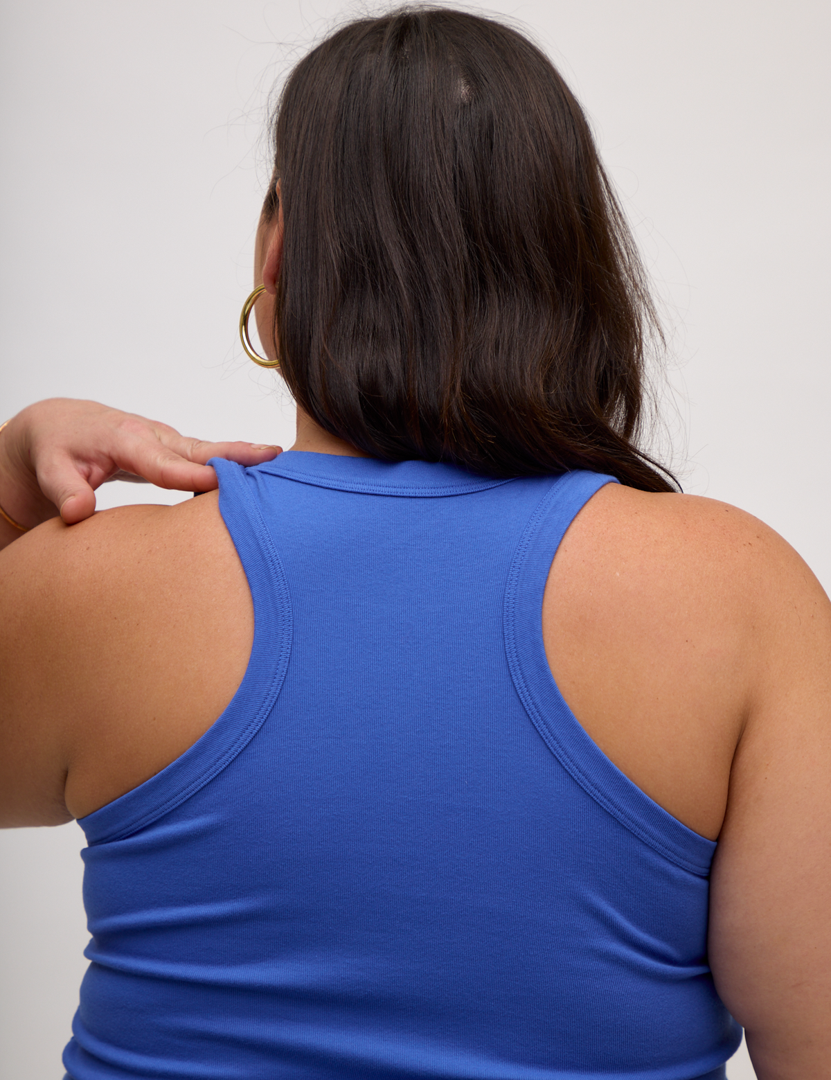 Close up back view of the Cornflower Blue Deep Cut Racerback on Kristen