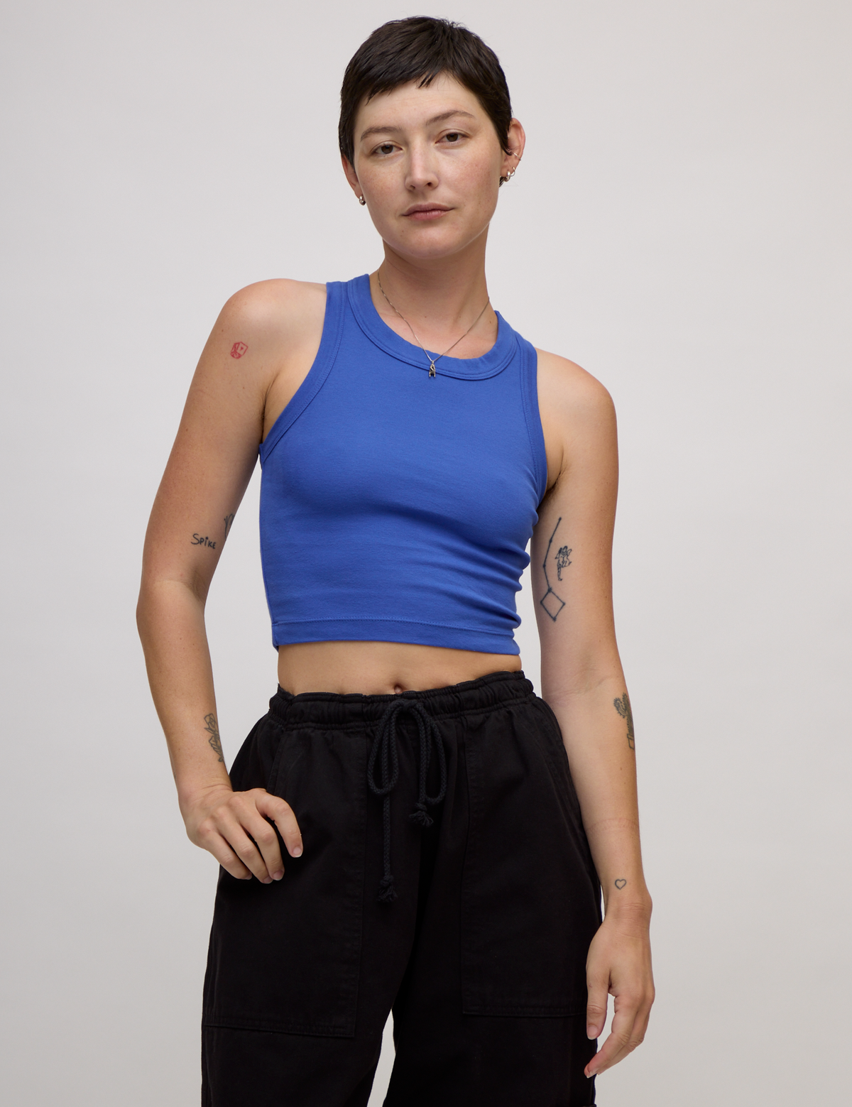 Alex wearing the Cornflower Blue Deep Cut Racerback