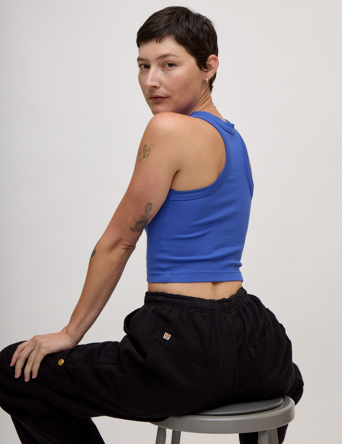 Angled back view of the Cornflower Blue Deep Cut Racerback on Alex