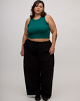 Kristen is 5'9" and wearing L Hunter Green Deep Cut Racerback with Black Drop Pocket Pants
