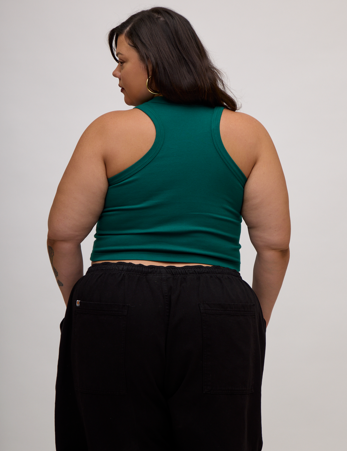 Back view of the Hunter Green Deep Cut Racerback on Kristen