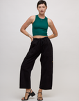 Alex wearing the Hunter Green Deep Cut Racerback and Black Drop Pocket Pants