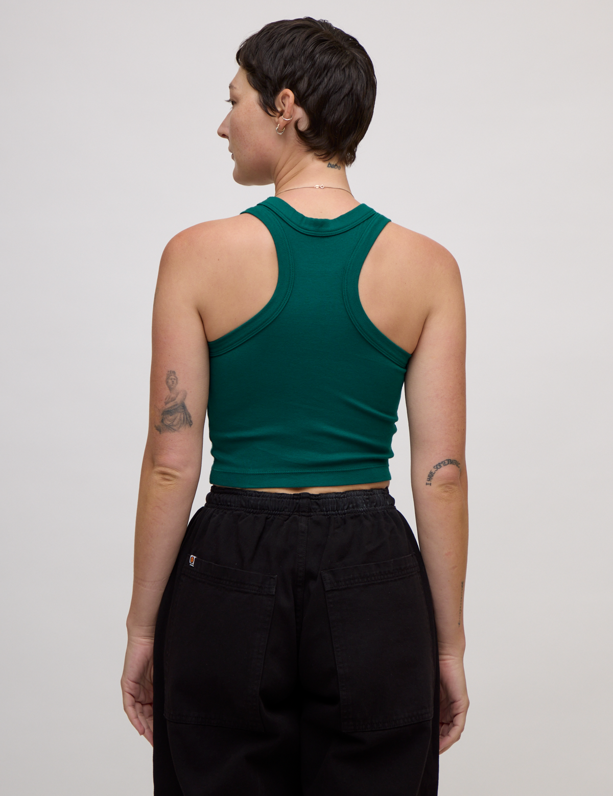 Back view of the Hunter Green Deep Cut Racerback on Alex