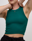 Close up of Alex wearing the Hunter Green Deep Cut Racerback