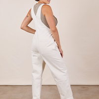 Angled back view of Original Overalls in Vintage Off-White and khaki grey Tank Top worn by Tiara