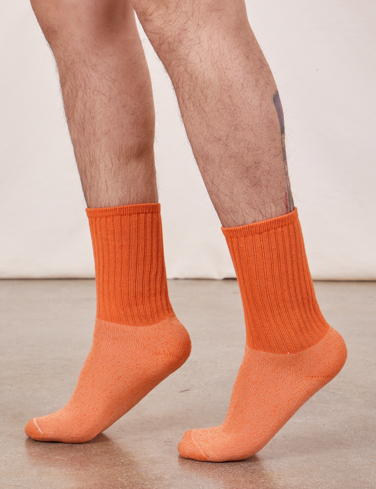 Thick Crew Sock in Sunset Orange on model