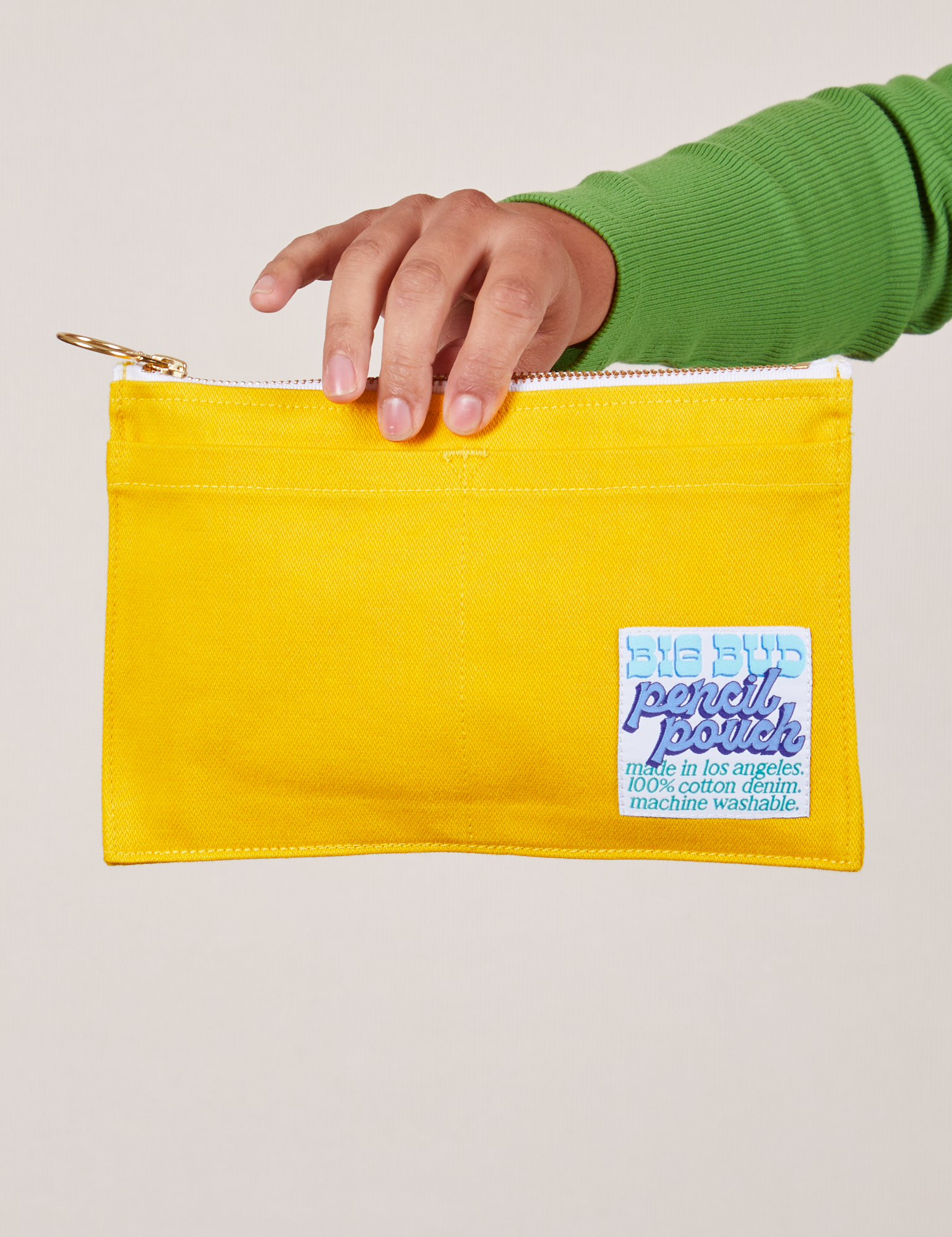 Pencil Pouch in Golden Yellow held by model