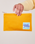 Pencil Pouch in Mustard Yellow held by model