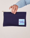 Pencil Pouch in Navy Blue held by model