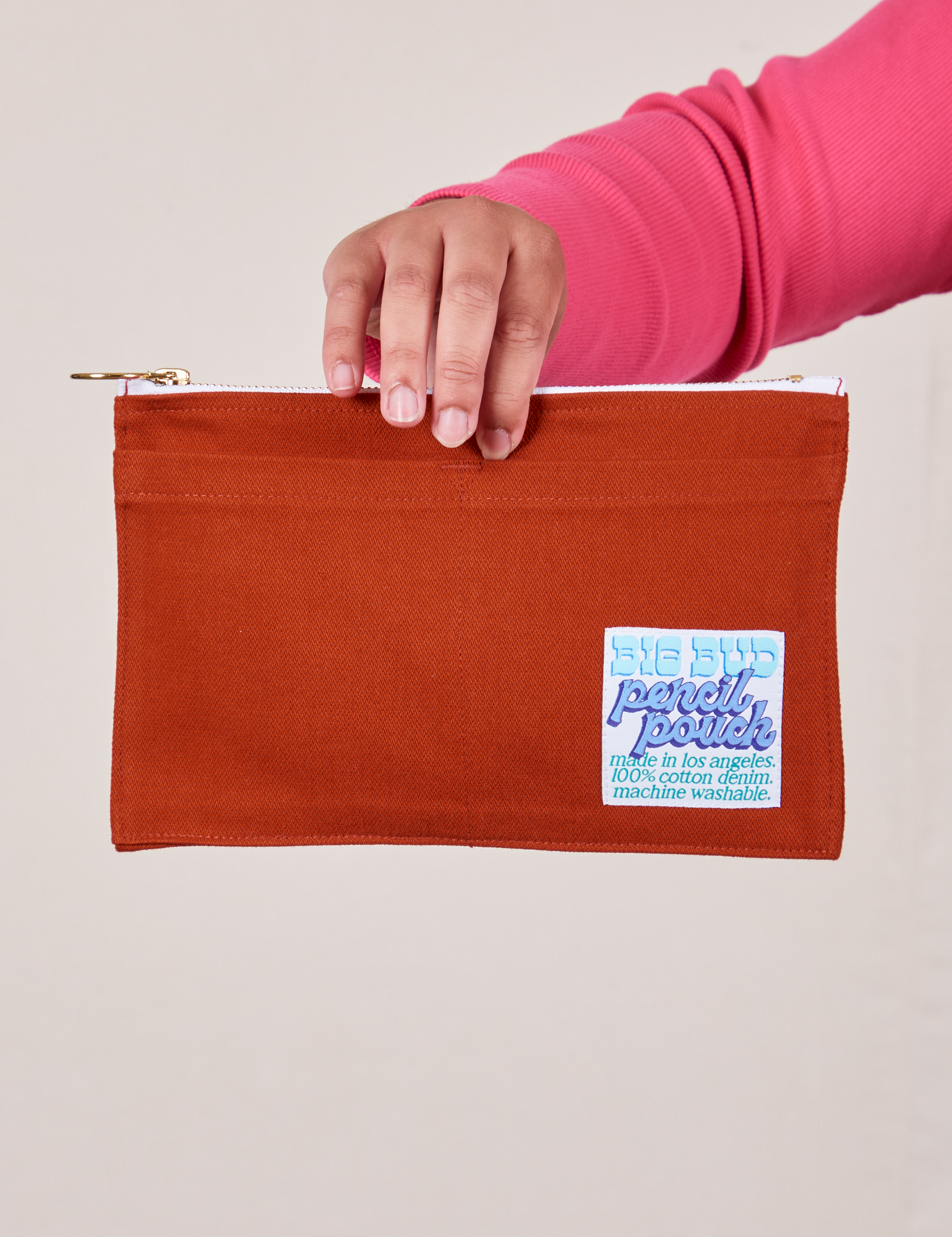 Pencil Pouch in Paprika Red held by model