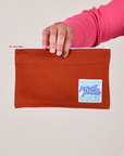 Pencil Pouch in Paprika Red held by model