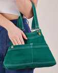 Overall Handbag in Hunter Green on arm of model