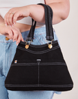 Overall Handbag in Basic Black worn on arm of model