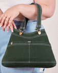 Overall Handbag in Swamp Green worn on arm of model