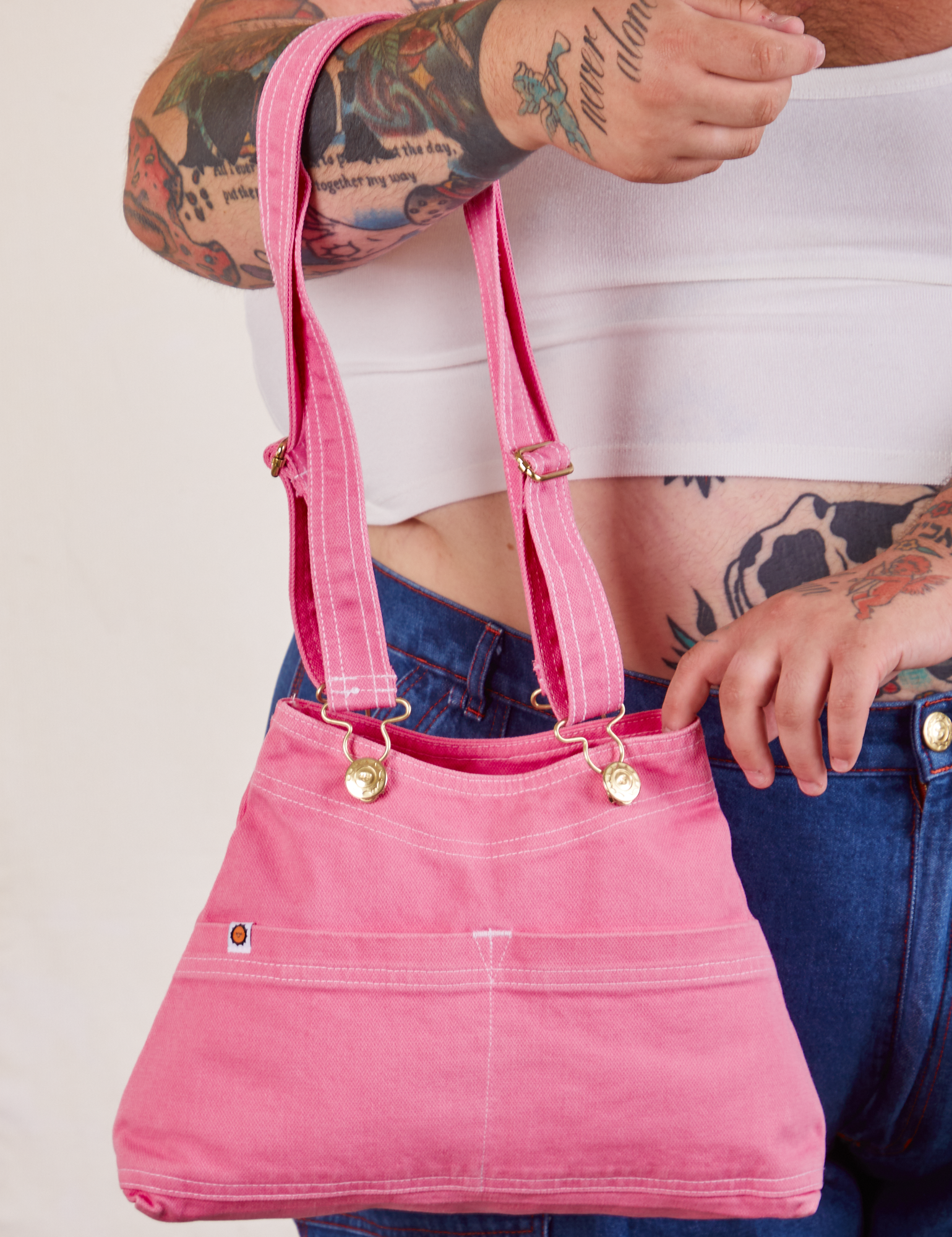 Overall Handbags in bubblegum with adjustable strap