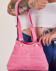 Overall Handbags in bubblegum with adjustable strap