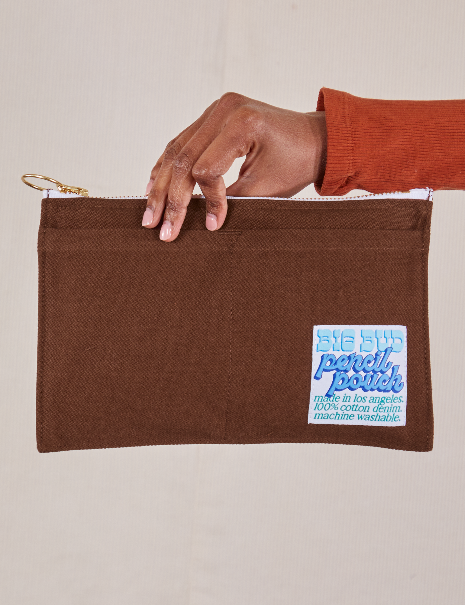 Pencil Pouch in Fudgesicle Brown held by model