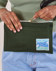 Pencil Pouch in Swamp Green held by model