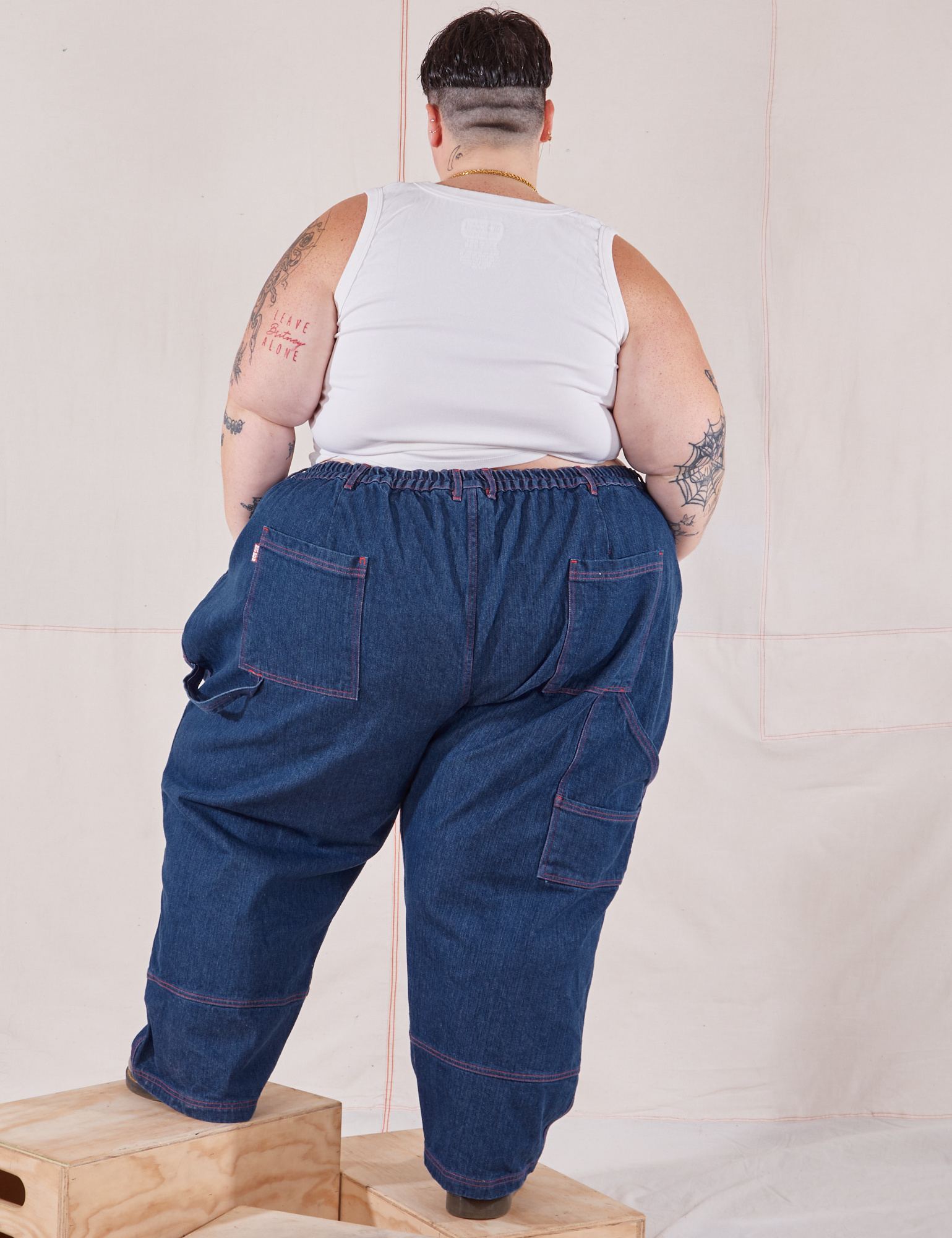 Back view of Petite Carpenter Jeans in Dark Wash and vintage off-white Tank Top on Jordan