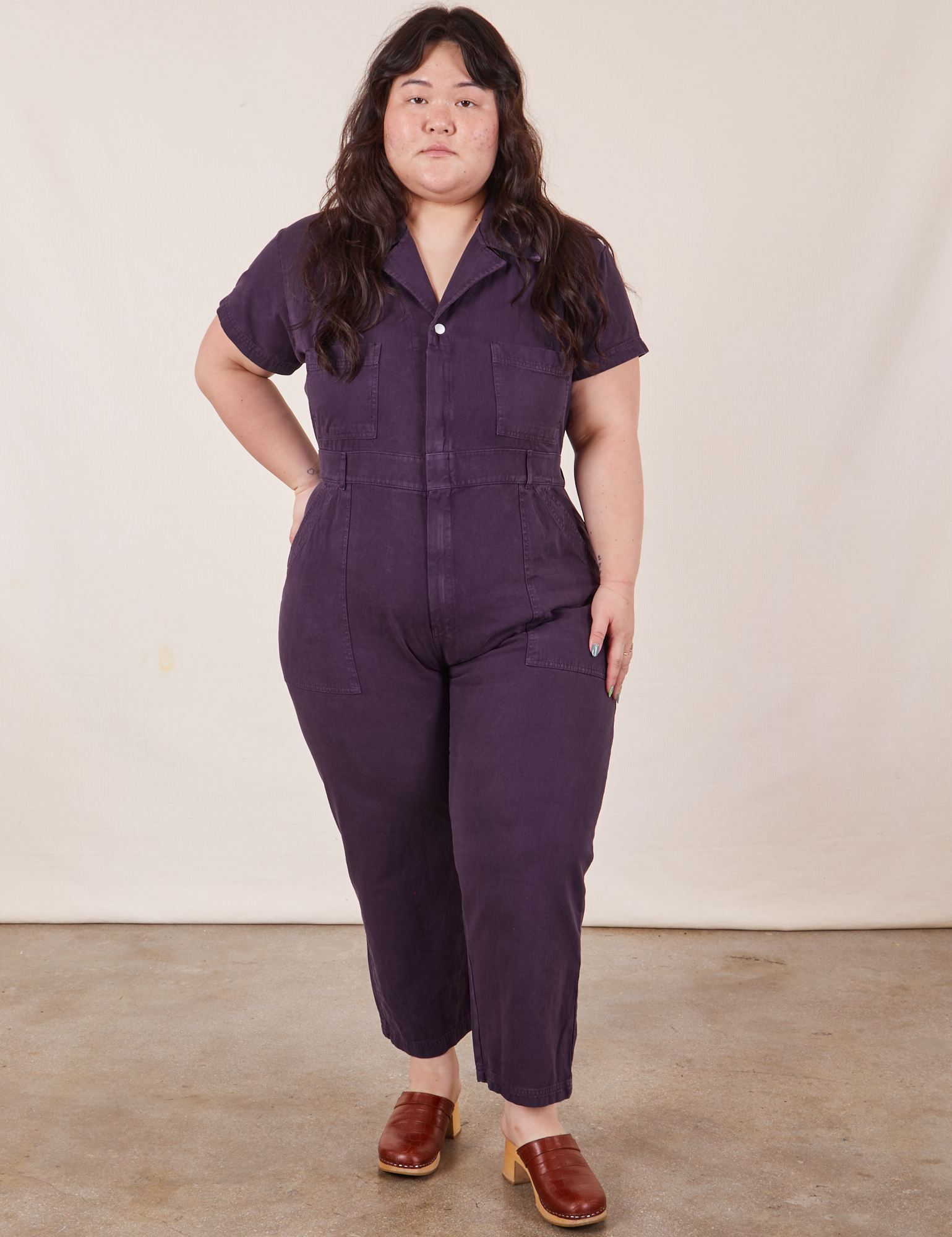 Ashley wearing 1XL Petite Petite Short Sleeve Jumpsuit in Nebula Purple