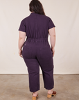 Back view of Petite Short Sleeve Jumpsuit in Nebula Purple worn by Ashley