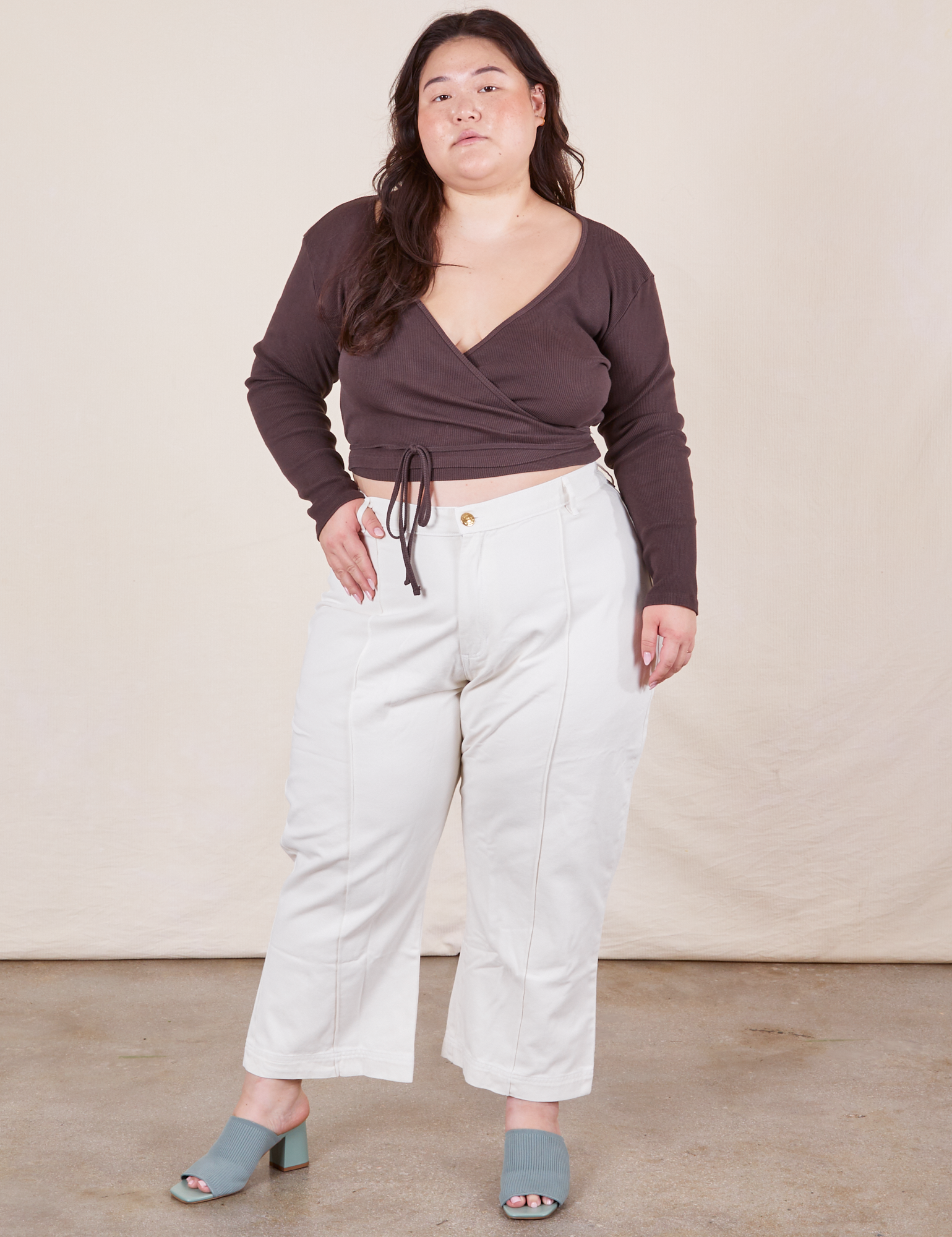 Ashley is 5&#39;7 and wearing 1XL Petite Western Pants in Vintage Off-White paired with espresso brown Wrap Top