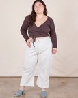 Ashley is 5'7 and wearing 1XL Petite Western Pants in Vintage Off-White paired with espresso brown Wrap Top