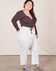 Side view of Western Pants in Vintage Off-White paired with an espresso brown Wrap Top worn by Ashley