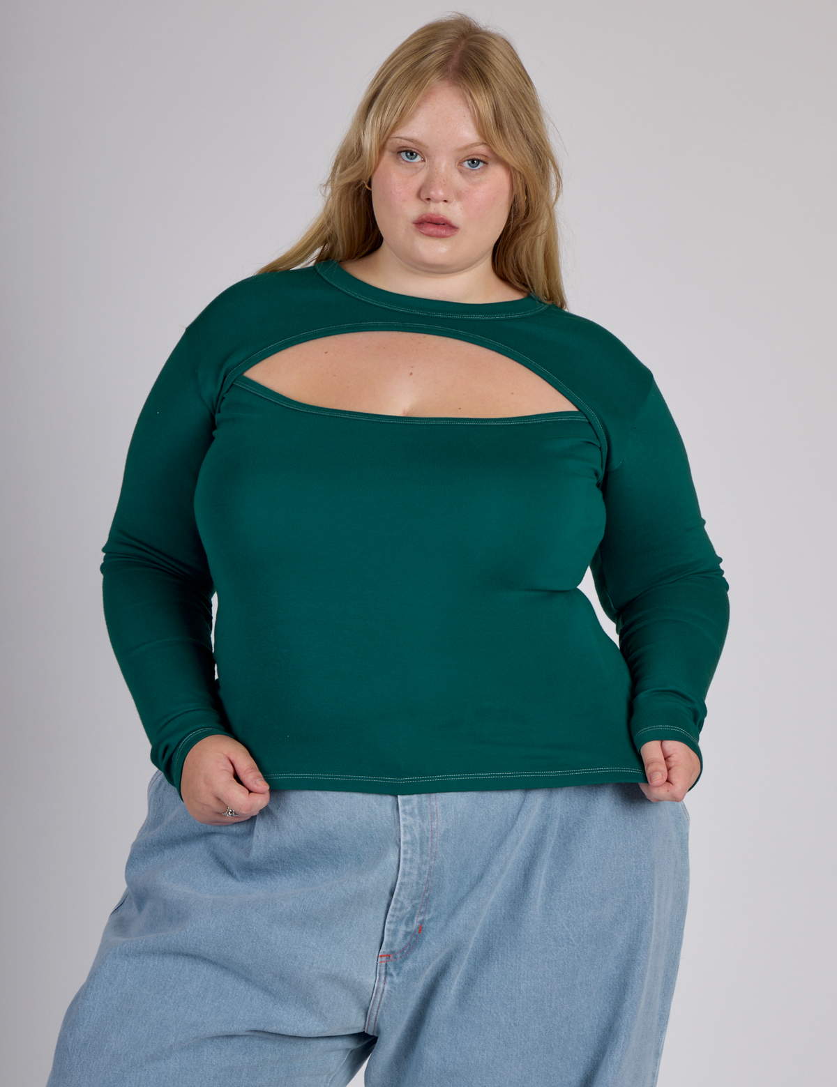 Juliet is 5'7" and wearing L Hunter Green Long Sleeve Porthole Tee