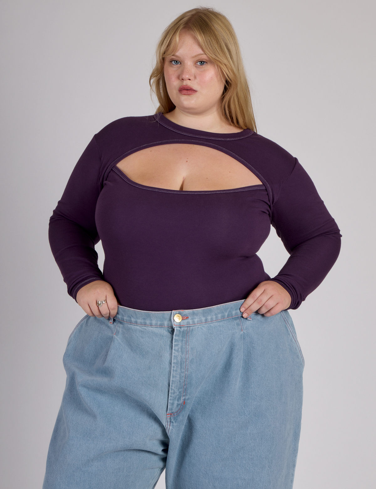 Juliet wearing the Nebula Purple Long Sleeve Porthole Tee tucked in