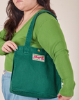 Shopper Tote Bag in Hunter Green worn over shoulder by Ashley
