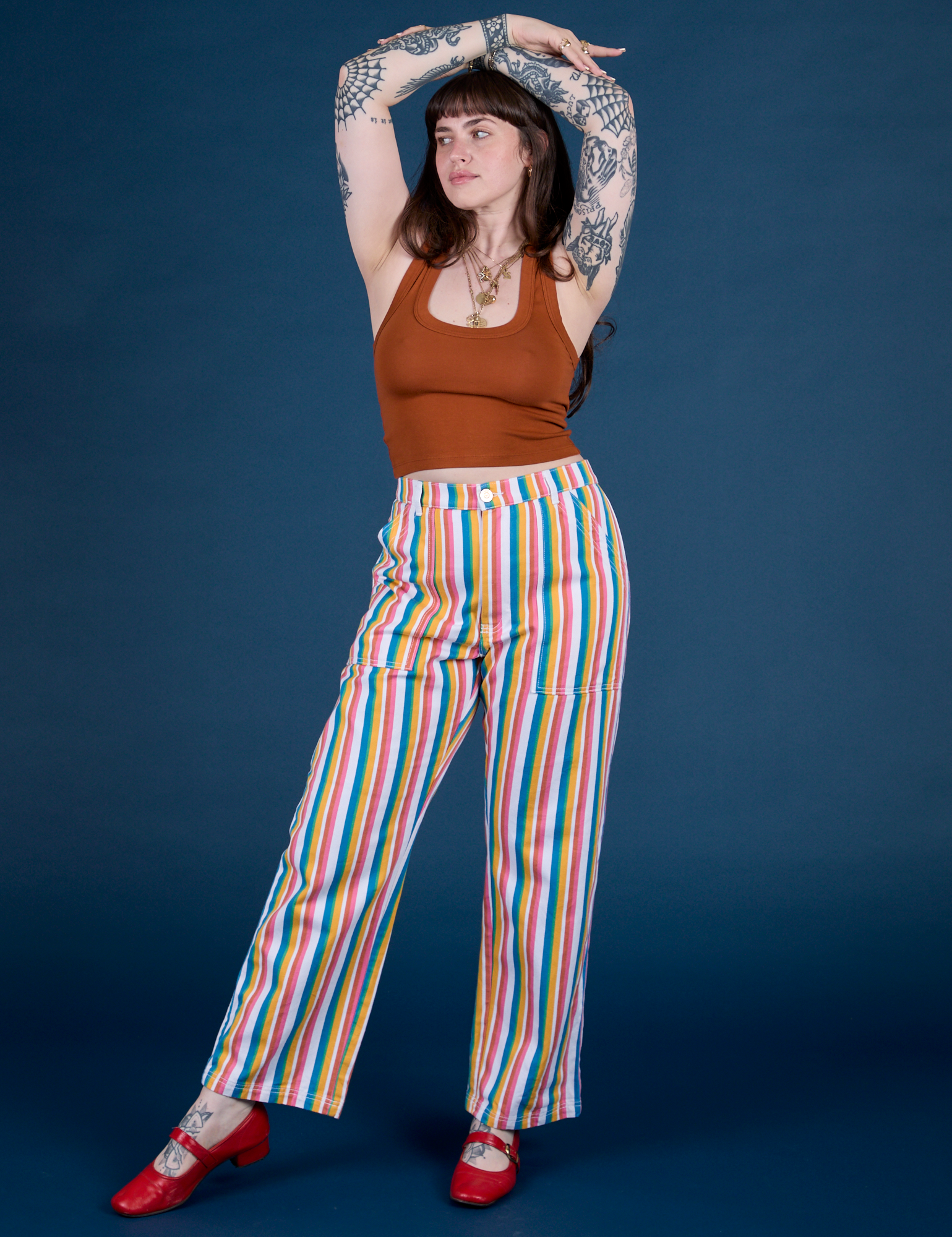 Sydney is 5’9” and wearing M Work Pants in Rainbow Stripe Work Pants in Rainbow Stripe