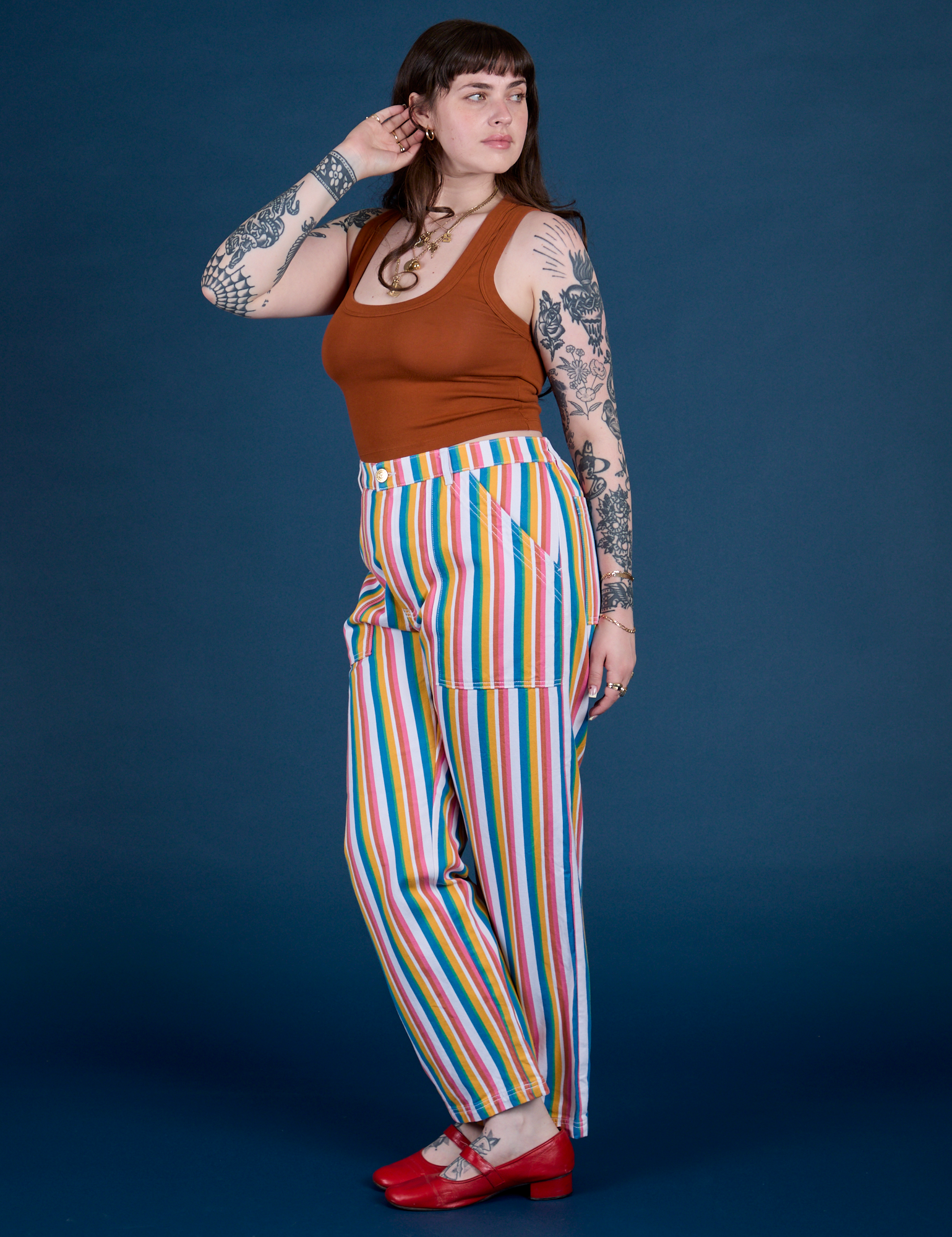 Side view of Work Pants in Rainbow Stripe and burnt terracotta on Sydney