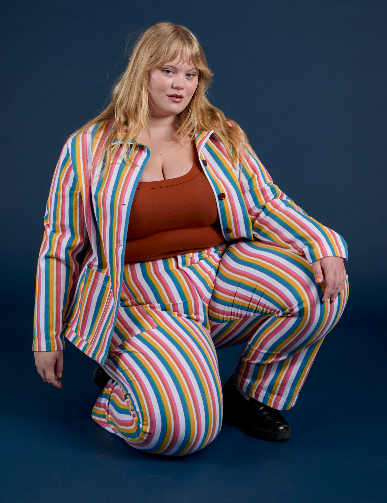 Juliet is wearing Work Pants in Rainbow Stripe and matching Work Jacket