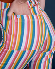 Close up of Alex's hand in the back pocket of Work Pants in Rainbow Stripe