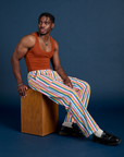 Isaac is 5’10” and wearing M Work Pants in Rainbow Stripe paired with burnt terracotta Cropped Tank