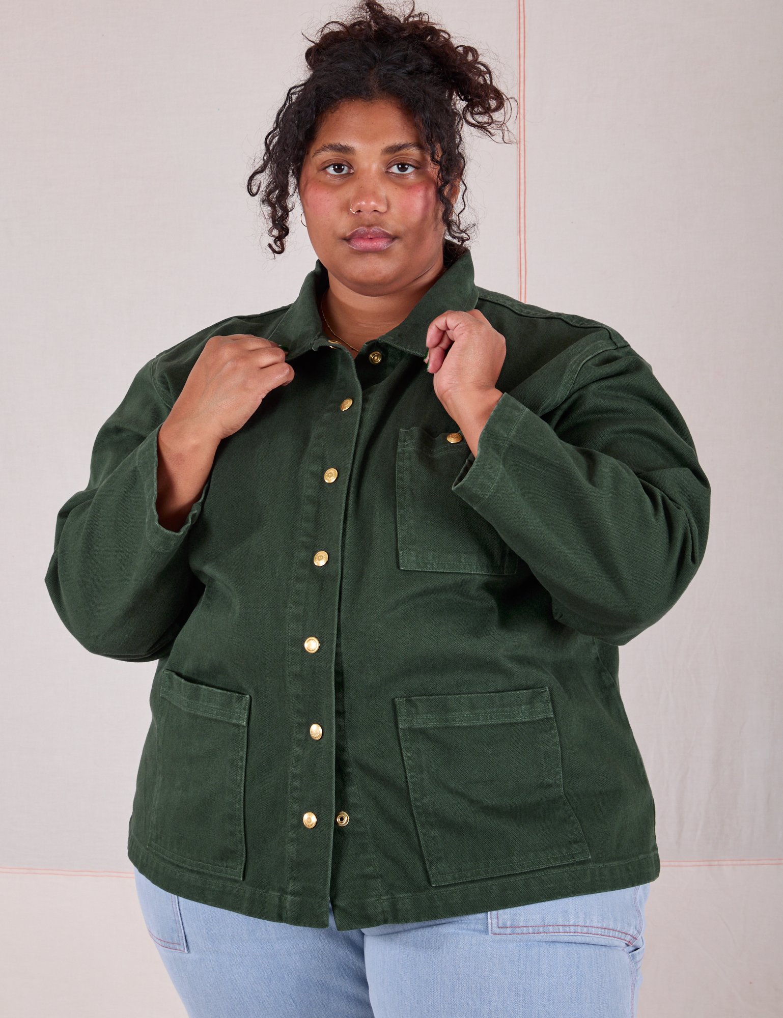 Morgan is wearing a buttoned up Denim Work Jacket in Swamp Green