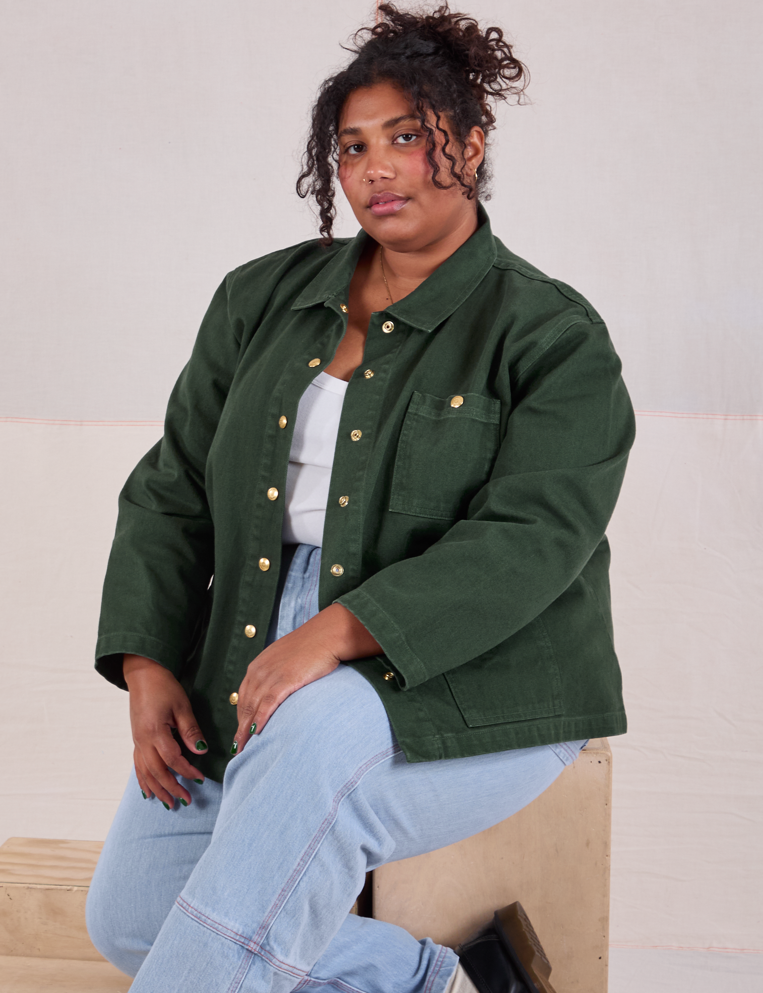 Morgan is wearing Denim Work Jacket in Swamp Green and light wash Carpenter Jeans