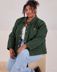 Morgan is wearing Denim Work Jacket in Swamp Green and light wash Carpenter Jeans