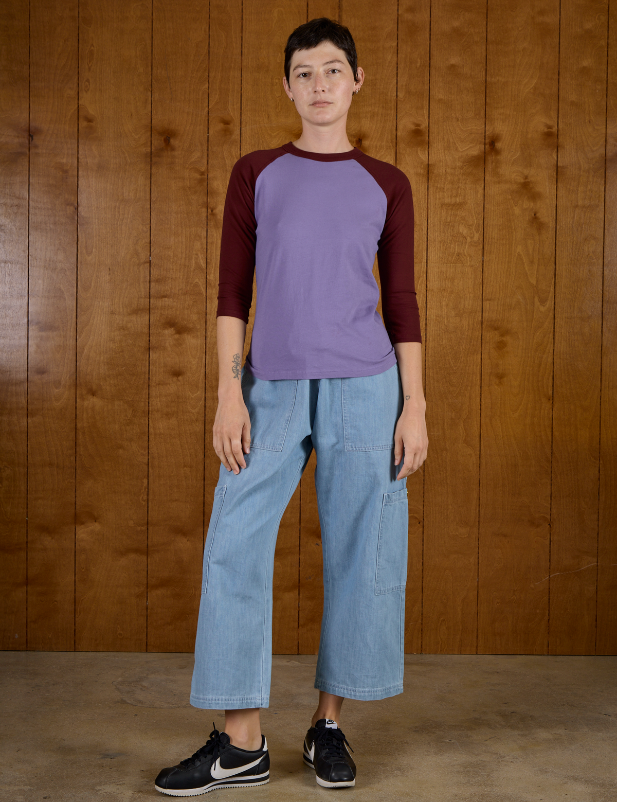 Alex is wearing the Faded Grape/Wine Colorblock Raglan Tee with Light Wash Denim Drop Pocket Pants