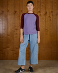 Alex is wearing the Faded Grape/Wine Colorblock Raglan Tee with Light Wash Denim Drop Pocket Pants