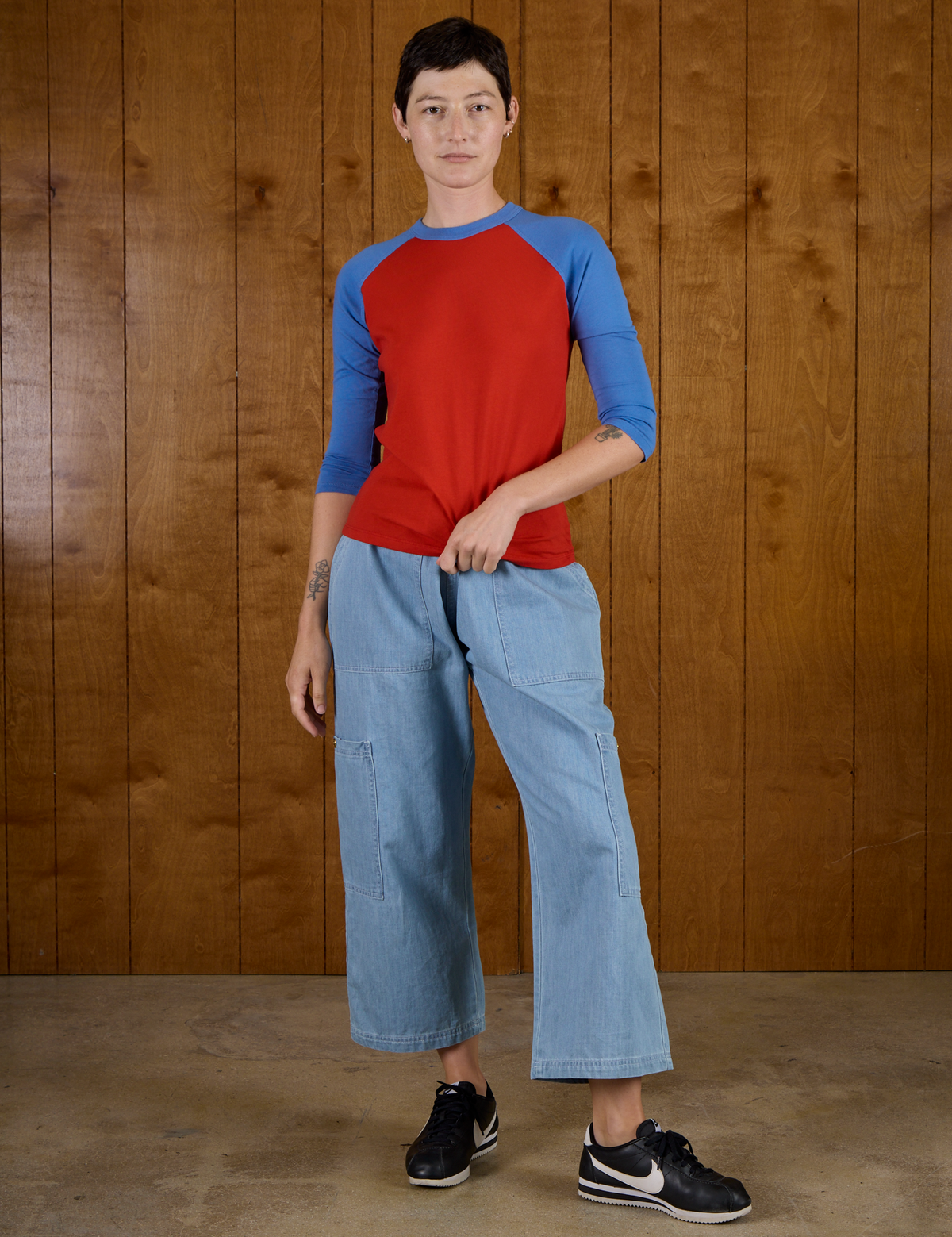 Alex wearing the Mustang Red/Blue Colorblock Raglan Tee with Light Wash Drop Pocket Pants