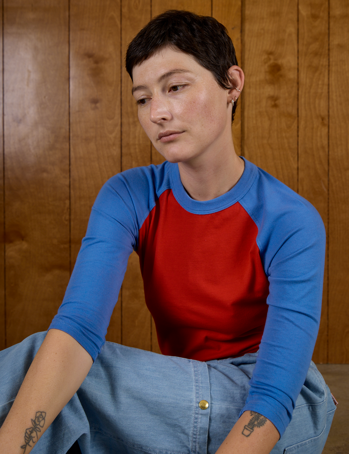 Alex wearing the Mustang Red/Blue Colorblock Raglan Tee