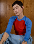 Alex wearing the Mustang Red/Blue Colorblock Raglan Tee