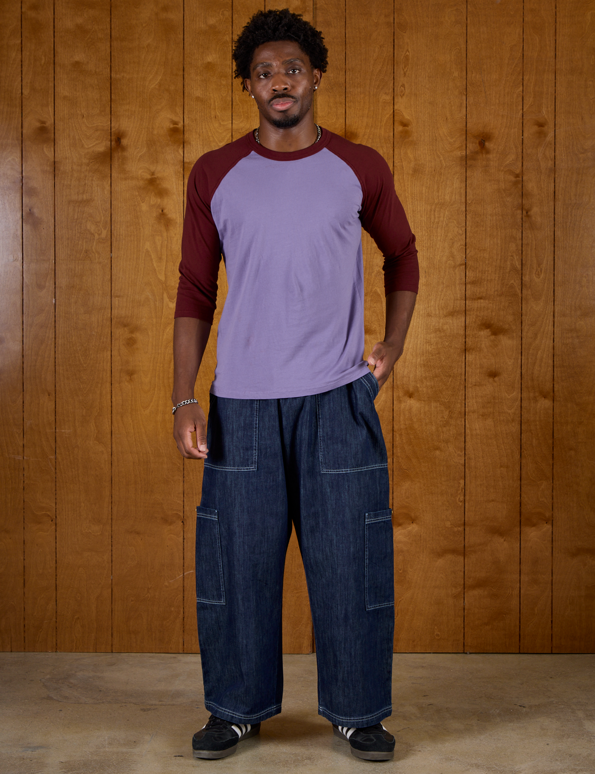 Isaac wearing the Faded Grape/Wine Colorblock Raglan Tee with the Dark Wash Denim Drop Pocket Pants