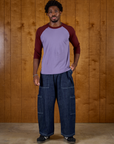 Isaac wearing the Faded Grape/Wine Colorblock Raglan Tee with the Dark Wash Denim Drop Pocket Pants