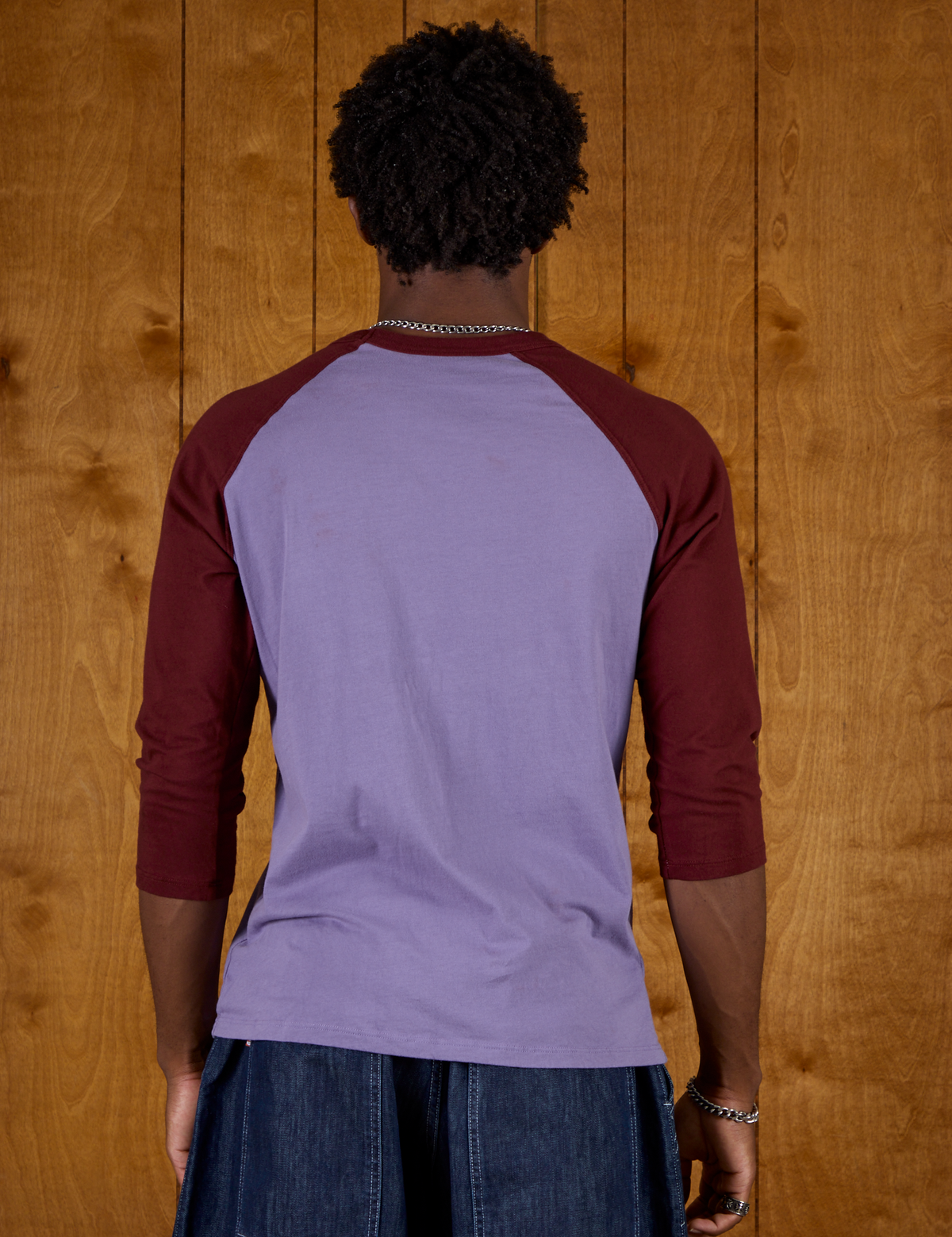 Back view of Isaac wearing the Faded Grape/Wine Colorblock Raglan Tee