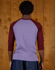 Back view of Isaac wearing the Faded Grape/Wine Colorblock Raglan Tee
