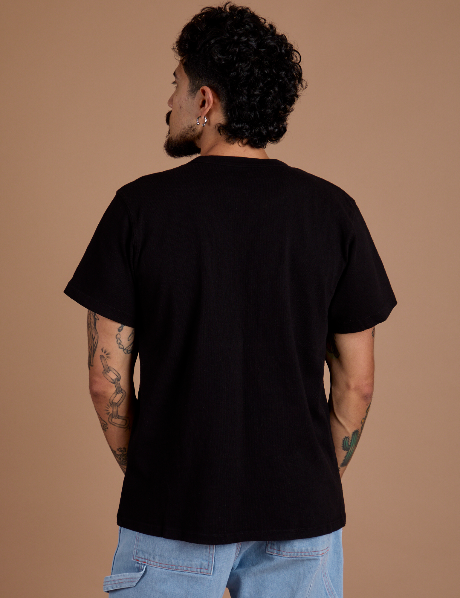 Burly Tee in Basic Black back view on Jesse