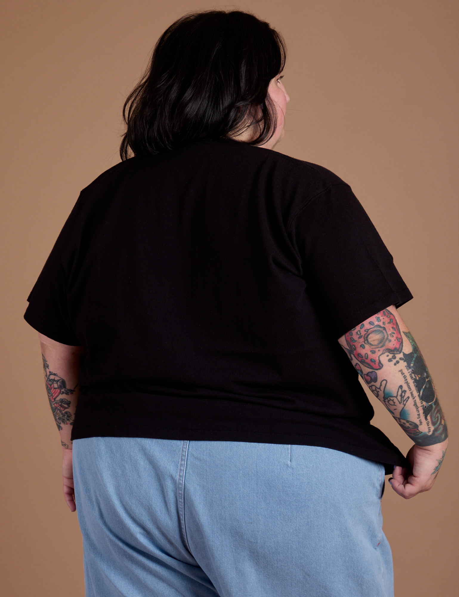 Burly Tee in Basic Black back view on Sam